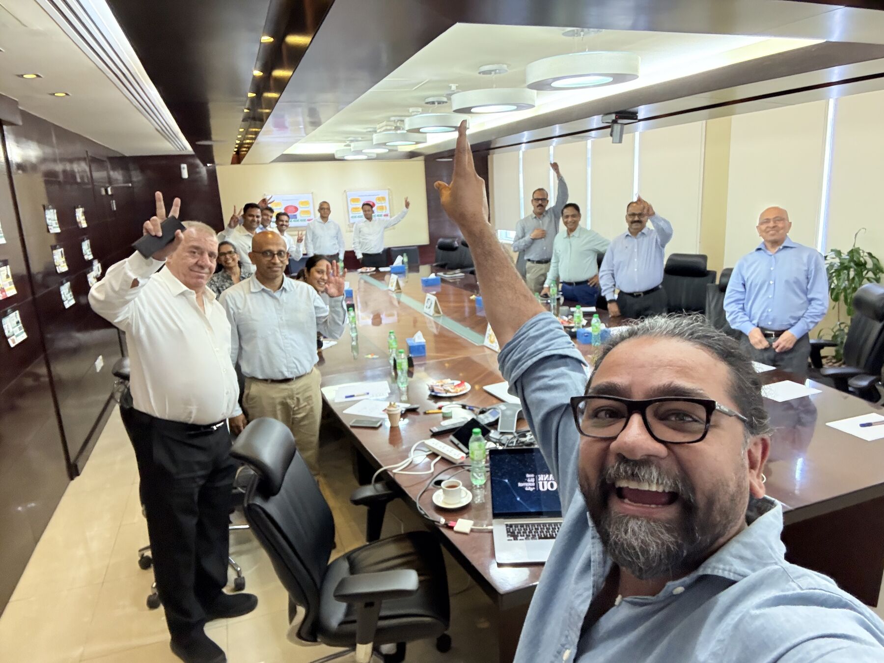 Sushobhan Chowdhury with a workshop team celebrating at the end of a session